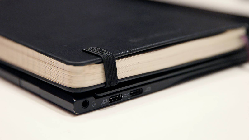 Check out how fat the Swift 7 makes a Moleskin notebook look, it’s crazy.